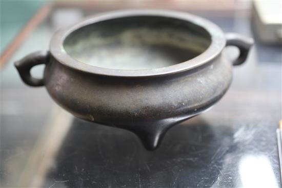 A Chinese brown patinated bronze ding censer, Xuande six character mark, probably 17th/18th century, width 21cm